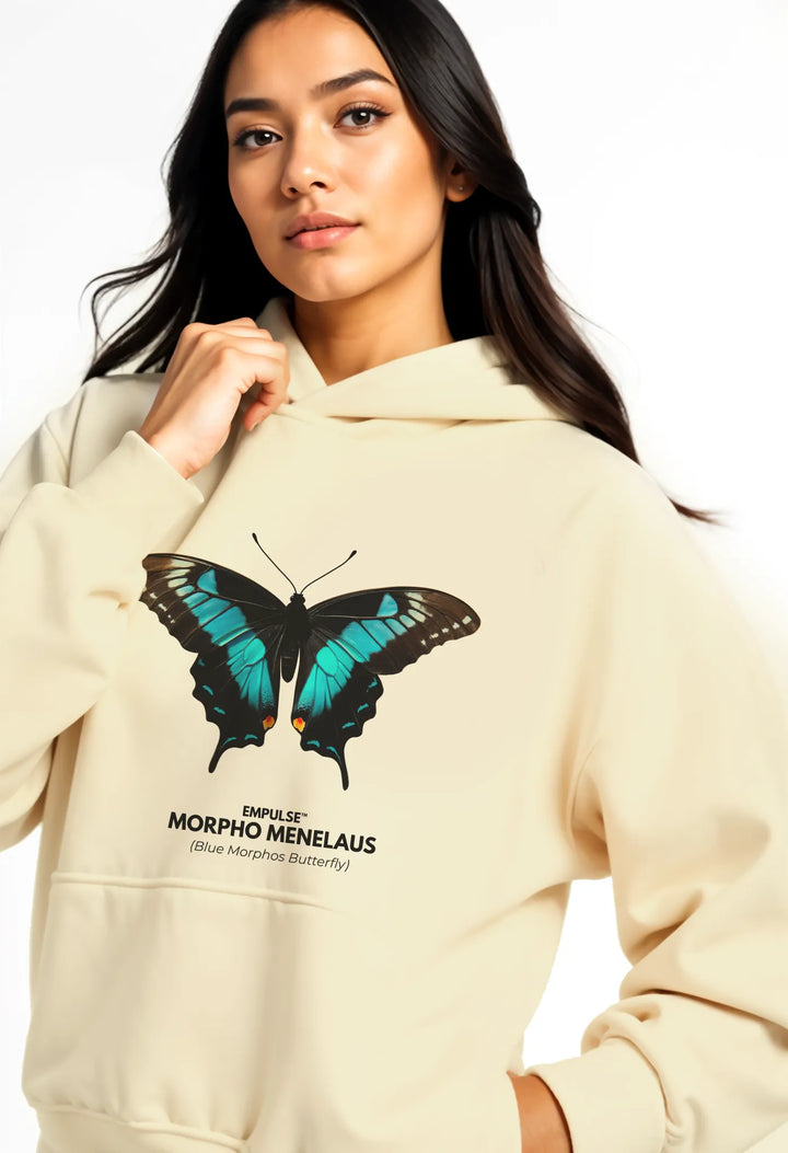 Close-up of beige Empulse™ hoodie showing bold butterfly print on chest