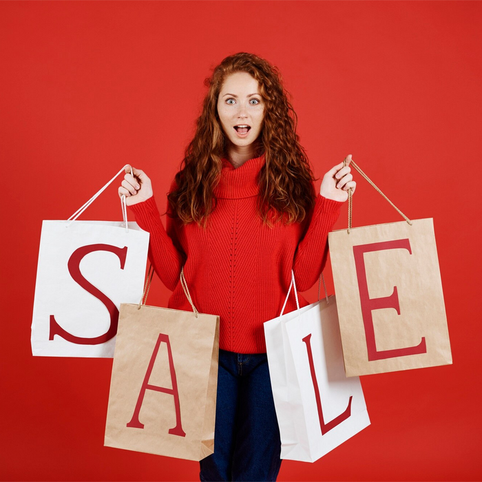 Empulse On Sale, a young woman carrying shopping bags