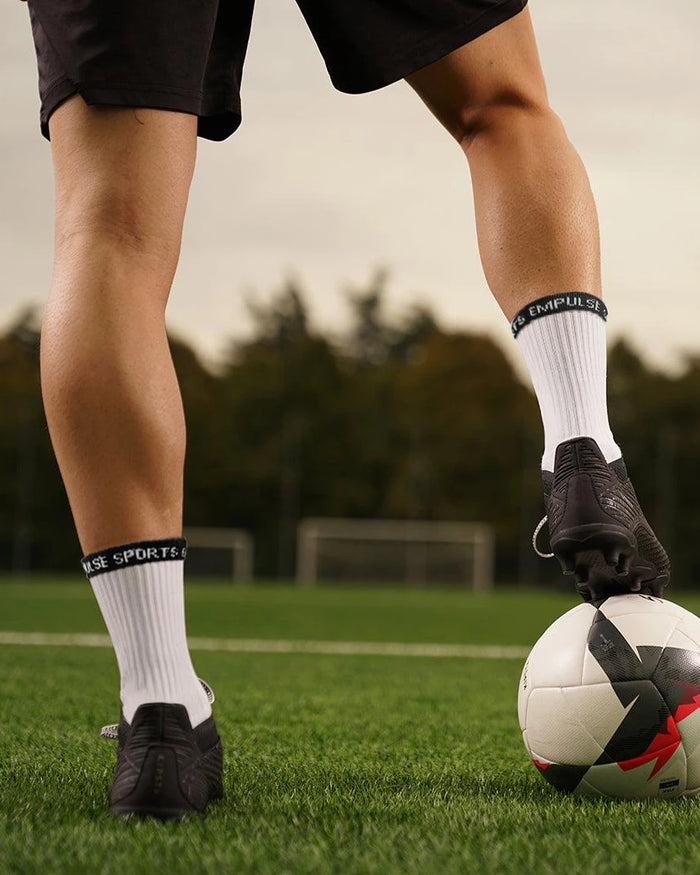 Empulse Grip Socks Pro Series Featuring White Socks on Football Field
