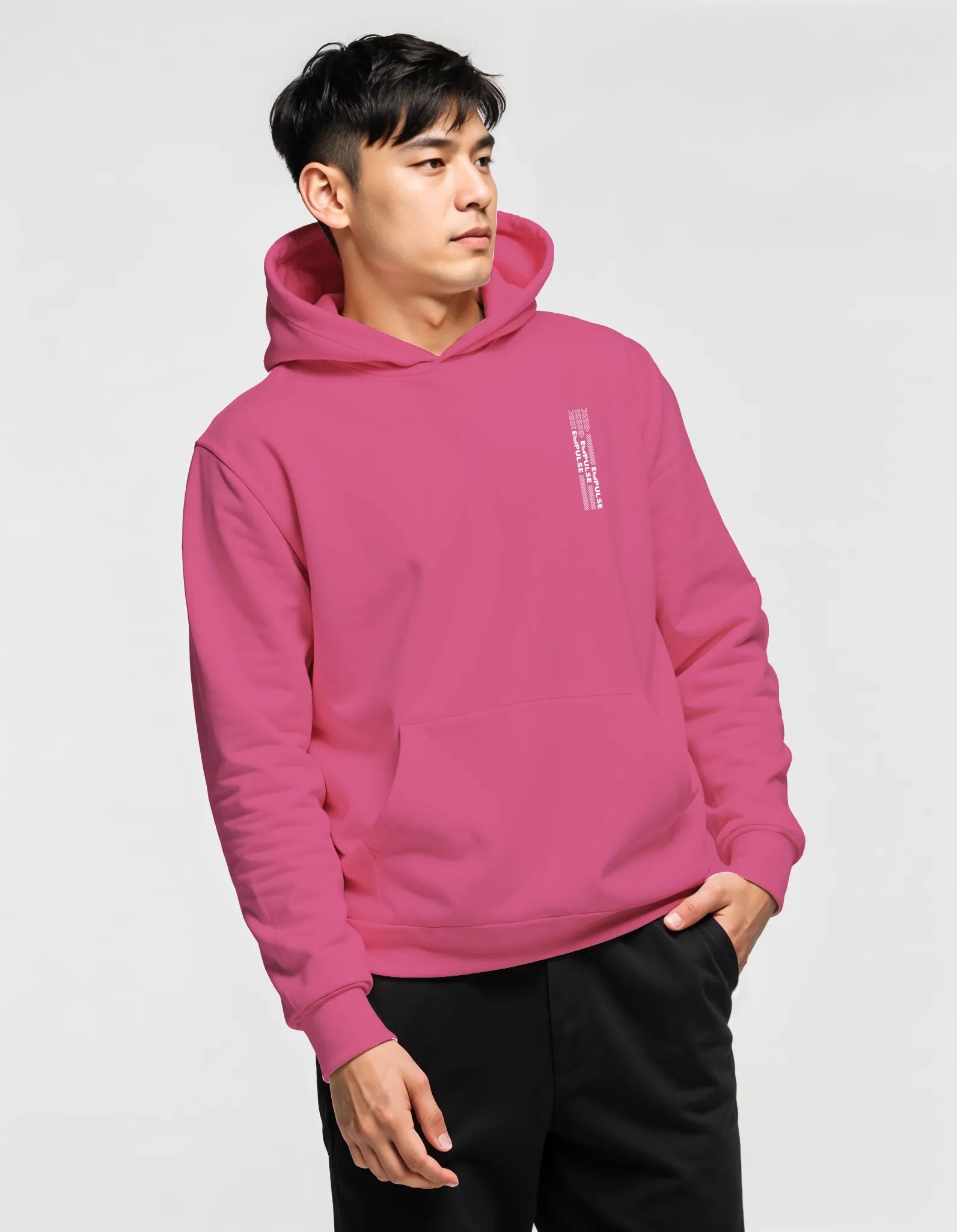 Man wearing Empulse™ pink hoodie with small vertical chest logo

