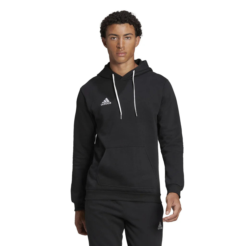 Person wearing a black Adidas Entrada 22 hoodie and pants on a white background