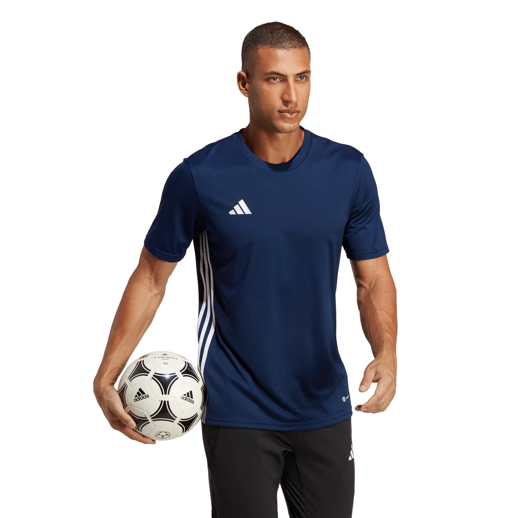 Man holding a soccer ball wearing an Adidas navy blue sports jersey on a white background