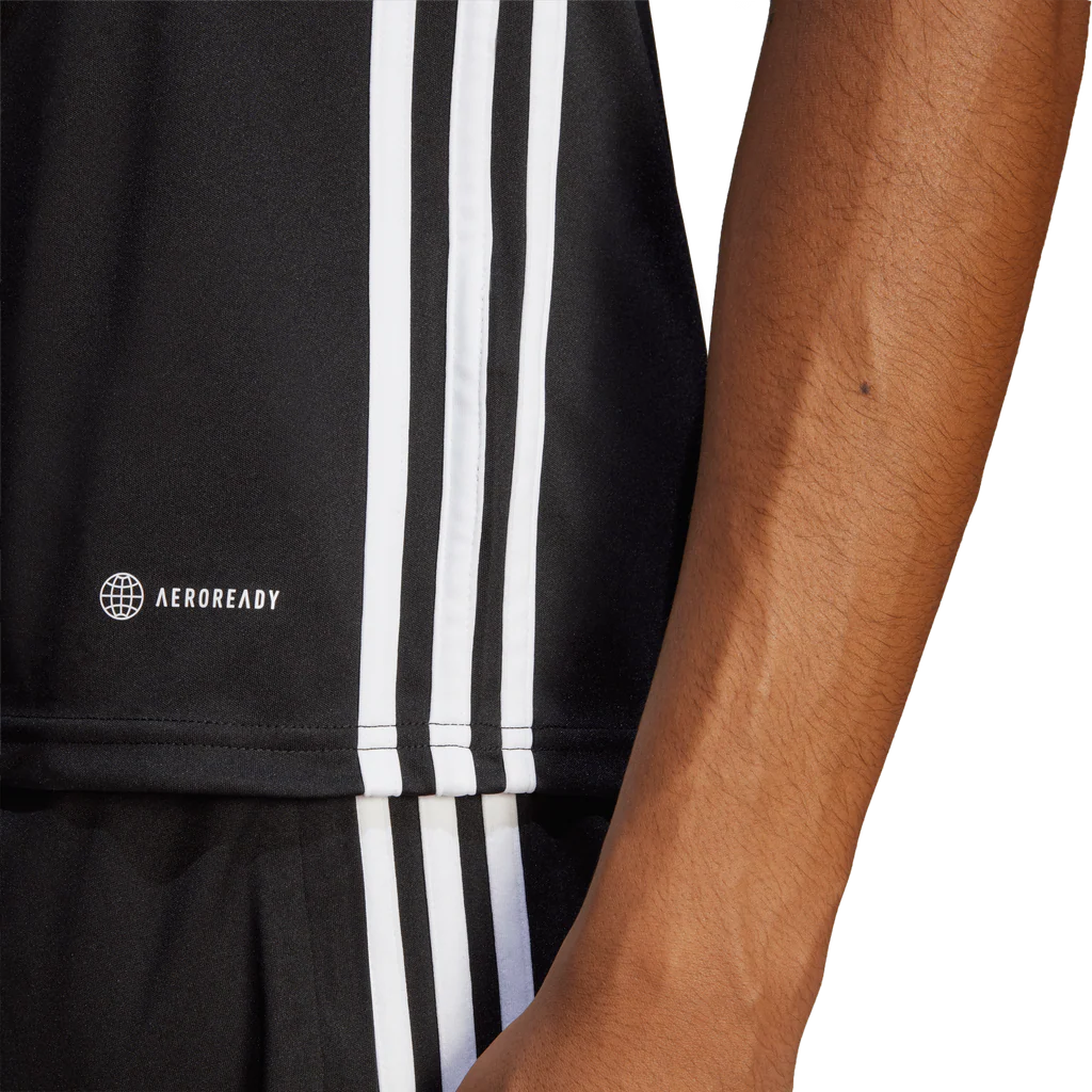 Black athletic shorts with white stripes and Aeroready logo on a person wearing them.