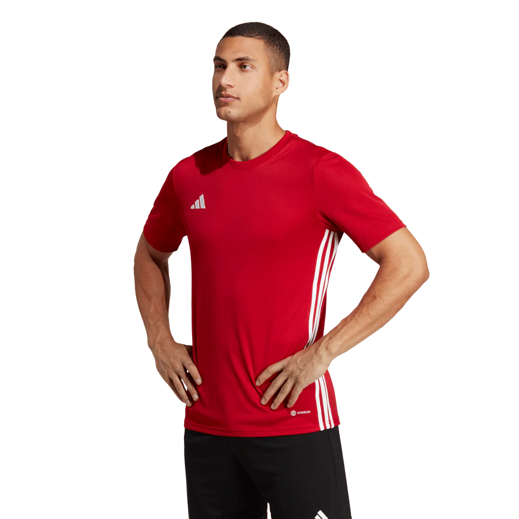 Man wearing a red Adidas sports jersey on a white background