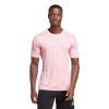 Person wearing a pink Adidas t-shirt on a white background