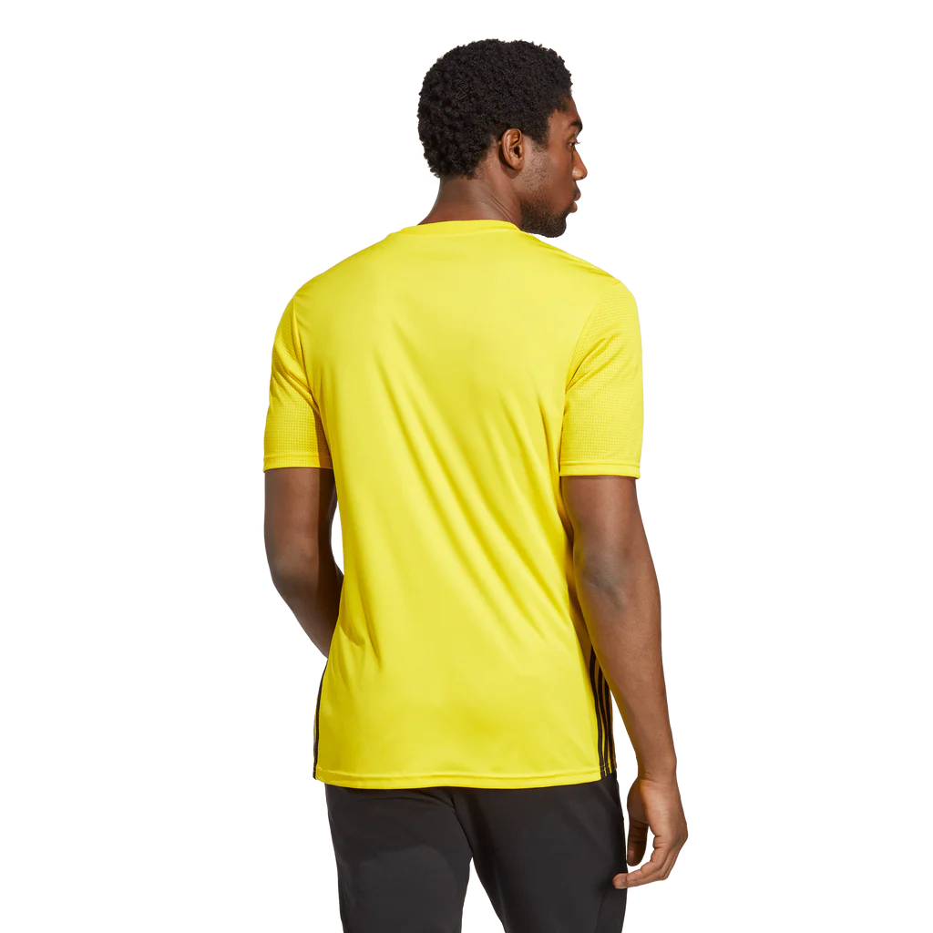 Person wearing a bright yellow t-shirt on a white background