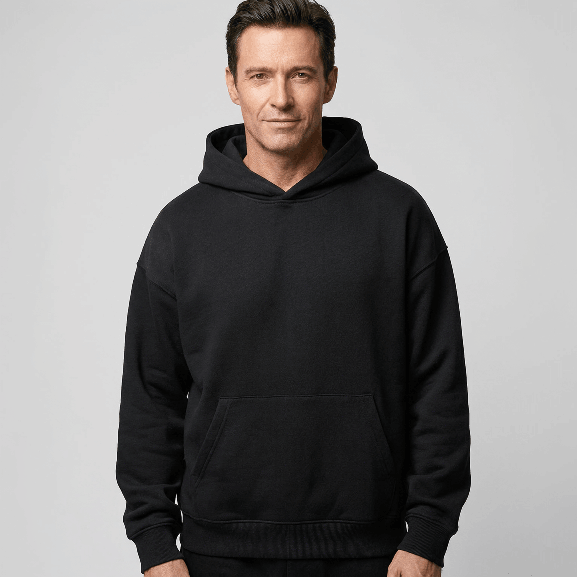 Custom Made Hoodie 5151 in Black, on-model, front view, 500 GSM 100% cotton French terry, Empulse custom branding