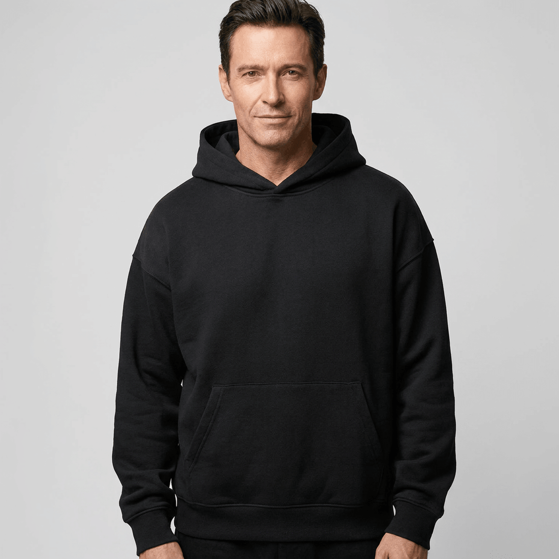 Custom Made Hoodie 5151 in Black, on-model, front view, 500 GSM 100% cotton French terry, Empulse custom branding