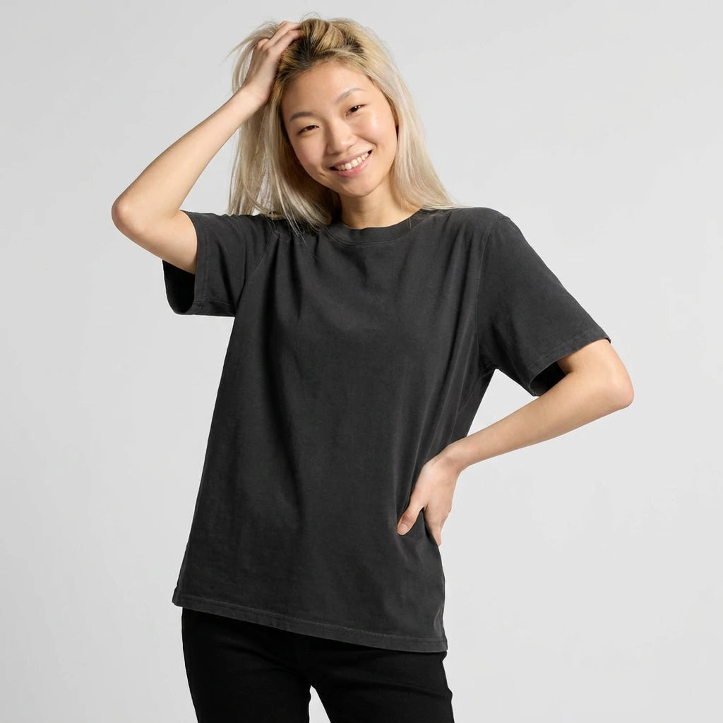 Person wearing a black t-shirt against a plain background