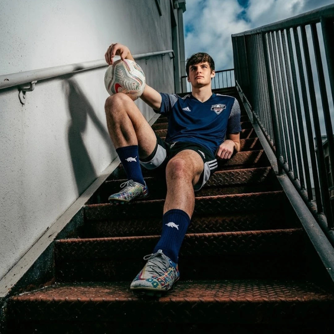 El Toro Grip Socks in Navy Blue worn by a soccer player