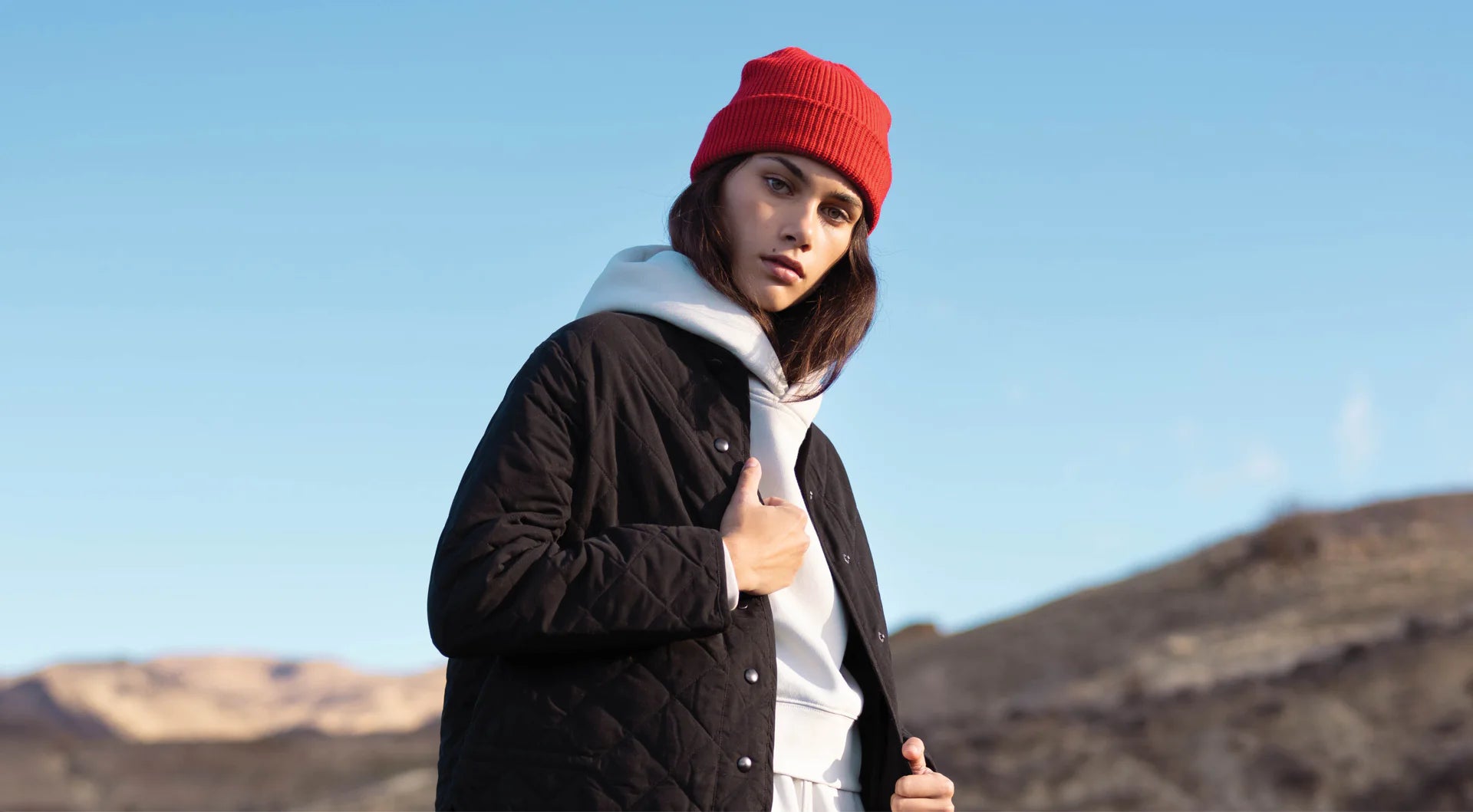 Empulse x AS Colour Crop Hoodie Banner featuring a female model with a red beanie