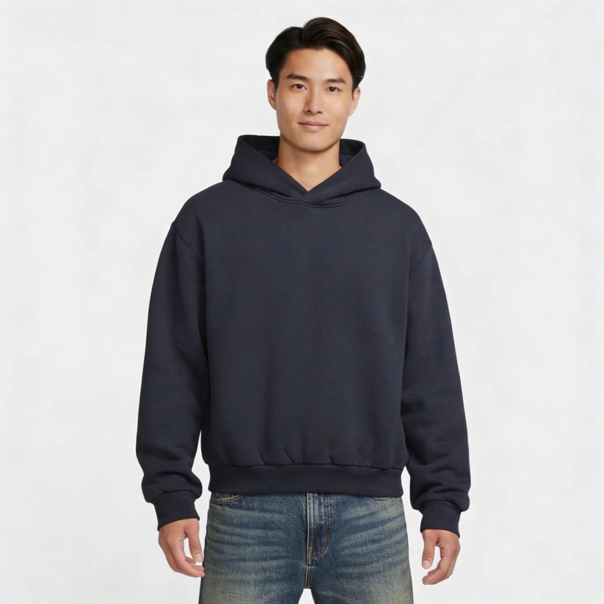 Man wearing a navy blue hoodie on a white background