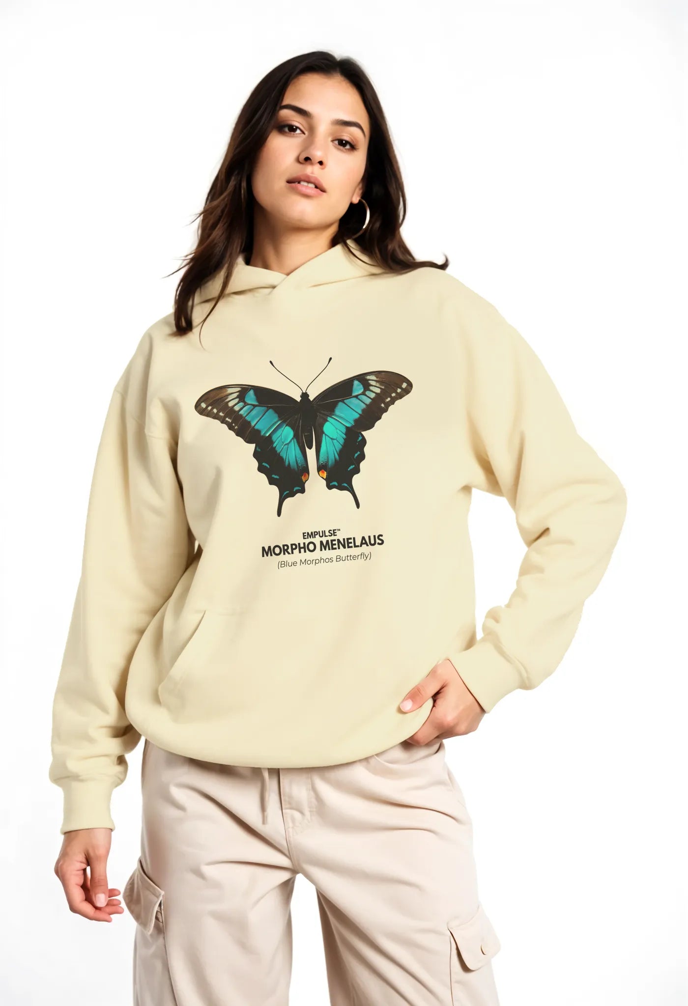 Woman wearing beige Empulse™ hoodie with large butterfly graphic on front