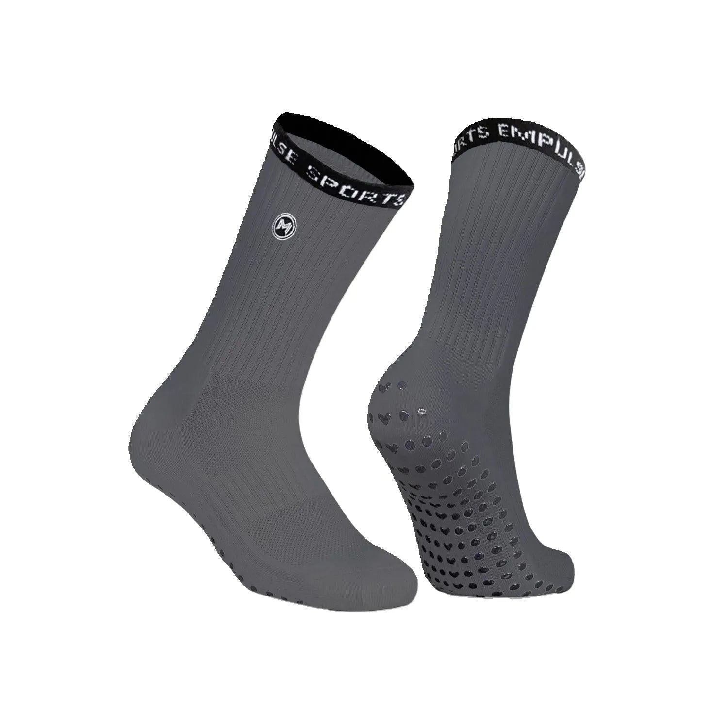 A pair of gray athletic grip socks with anti-slip technology, featuring reinforced arch support and a seamless toe closure.