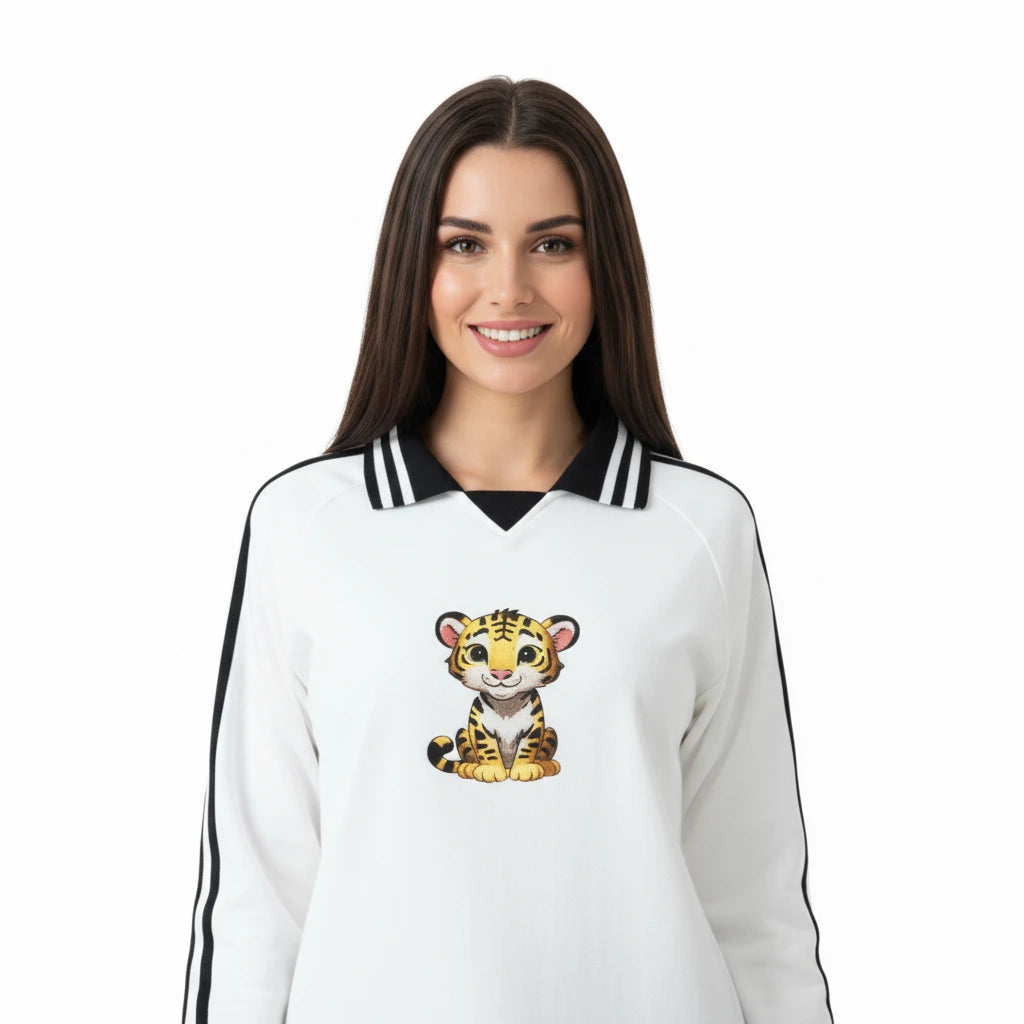 Woman wearing a white sweatshirt with a cartoon tiger design on a white background