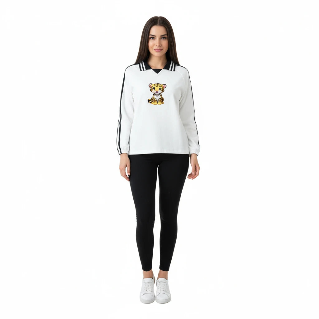 Woman wearing a white sweatshirt with a tiger design and black leggings on a white background