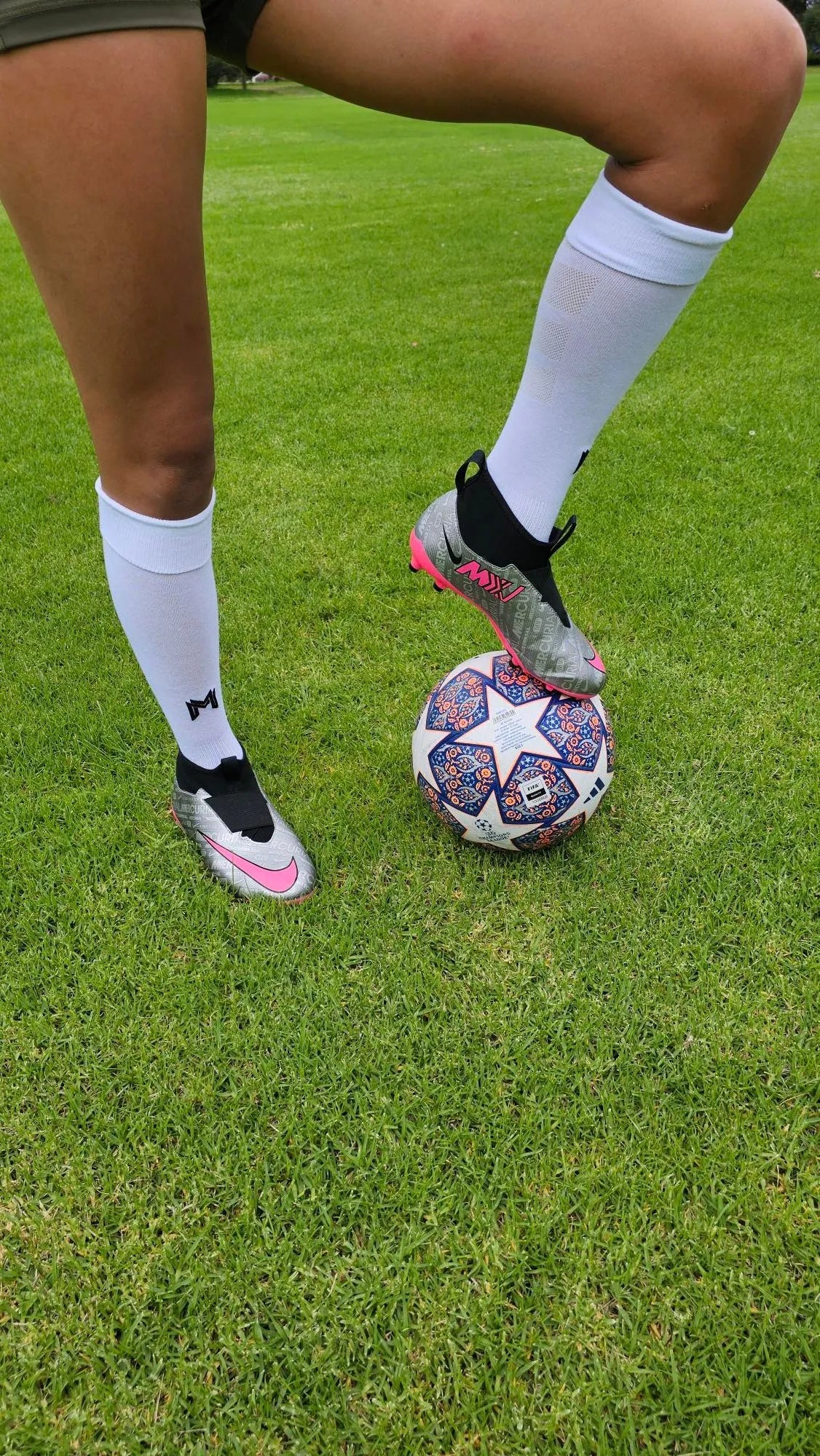 A female model wearing Empulse knee high compression socks in white front