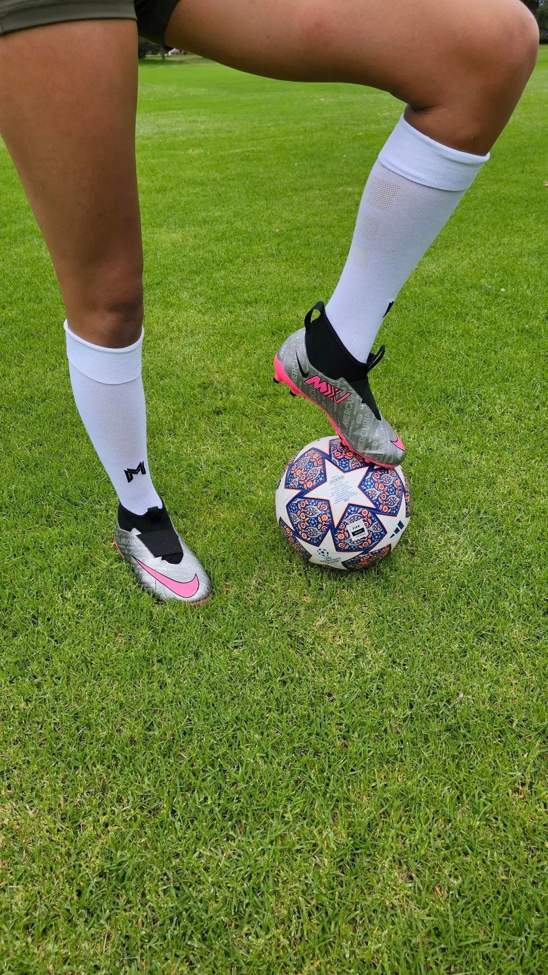 A female model wearing Empulse knee high compression socks in white front