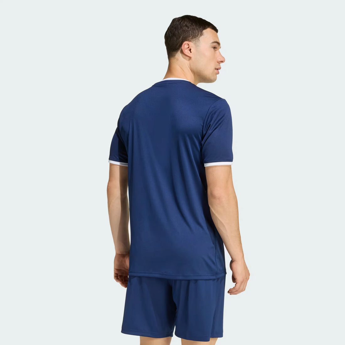 Man wearing a Blue Entrada 26 outfit on a white background