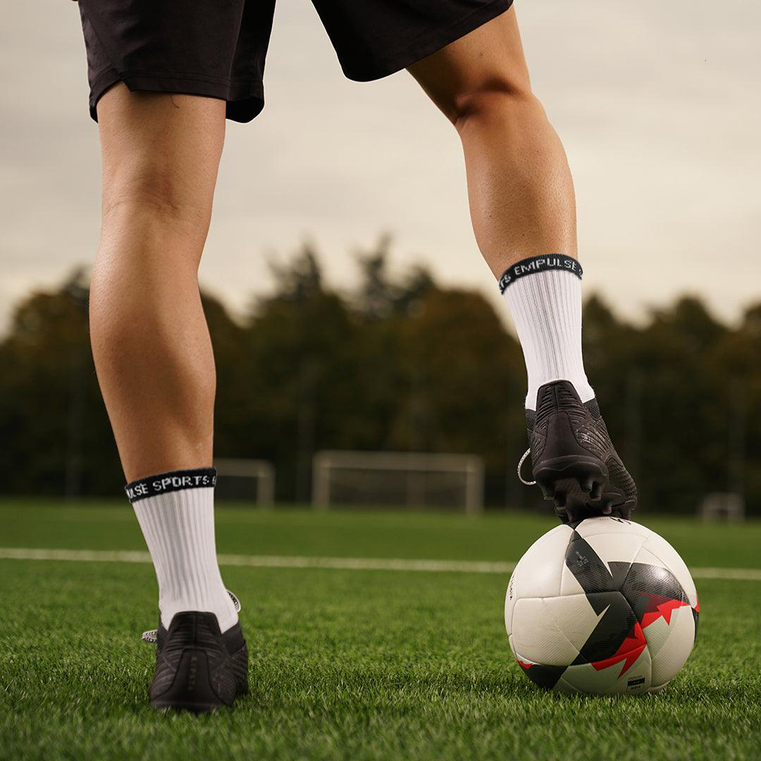 Empulse™ Grip Socks Pro White Worn On Pitch