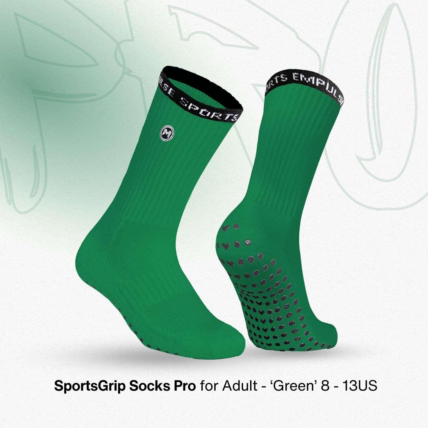 Green sports grip socks with black accents on a light green background