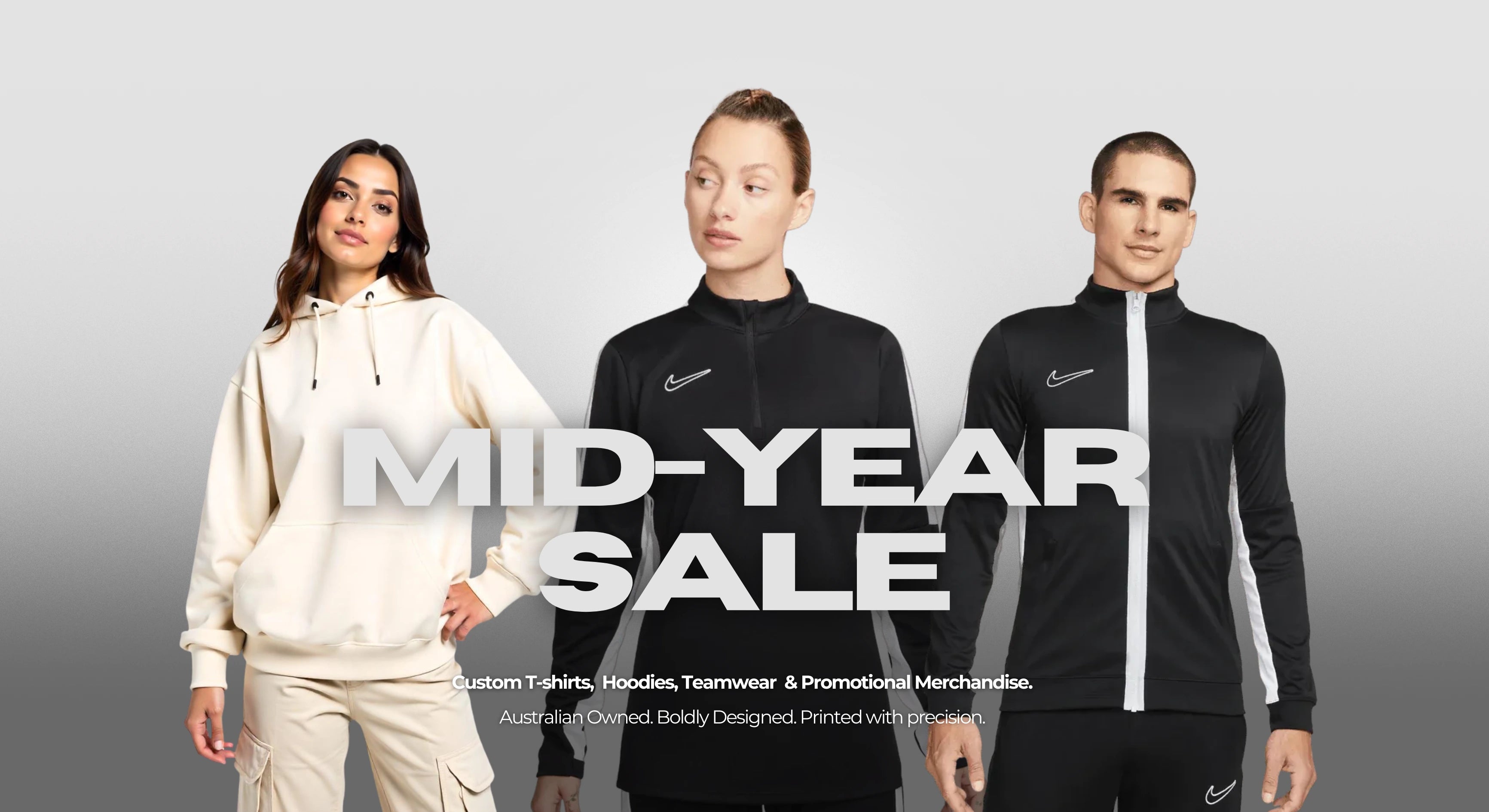 Three people wearing athletic jackets with 'Mid-Year Sale' text overlay on a gray background by Empulse.