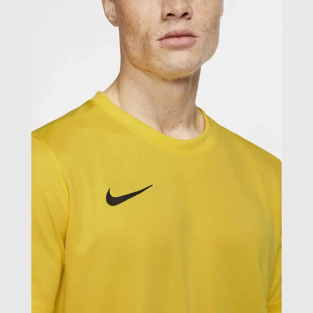 Close-up of chest on Nike Men's Park 7 Jersey in yellow showing black swoosh logo