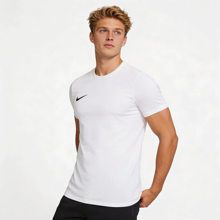 Man wearing a white Nike t-shirt on a light gray background