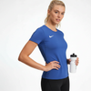 Woman wearing Nike Park 8 Jersey in royal blue, women's soccer jersey