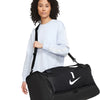 Female model with Nike Academy Team Duffel Bag black, lifestyle view
