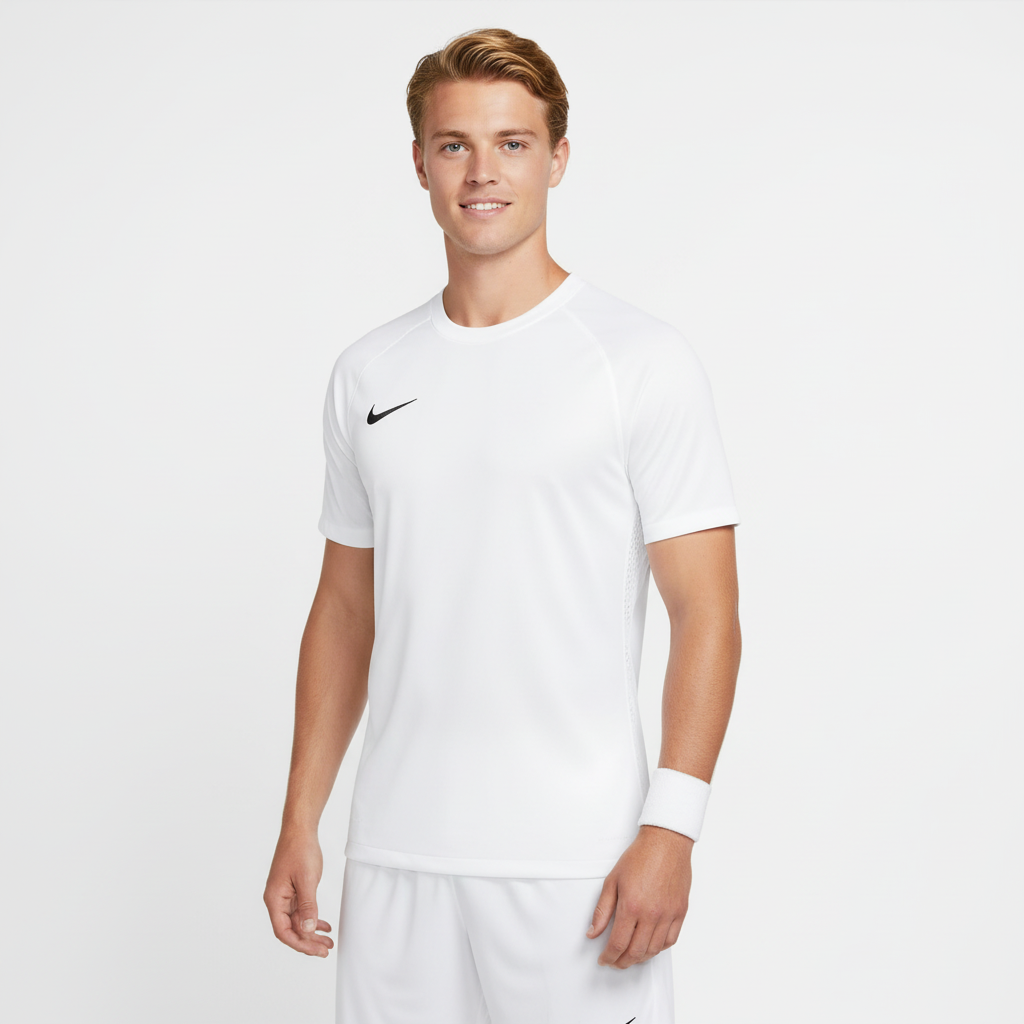 Man wearing a white Nike soccer jersey on a light gray background