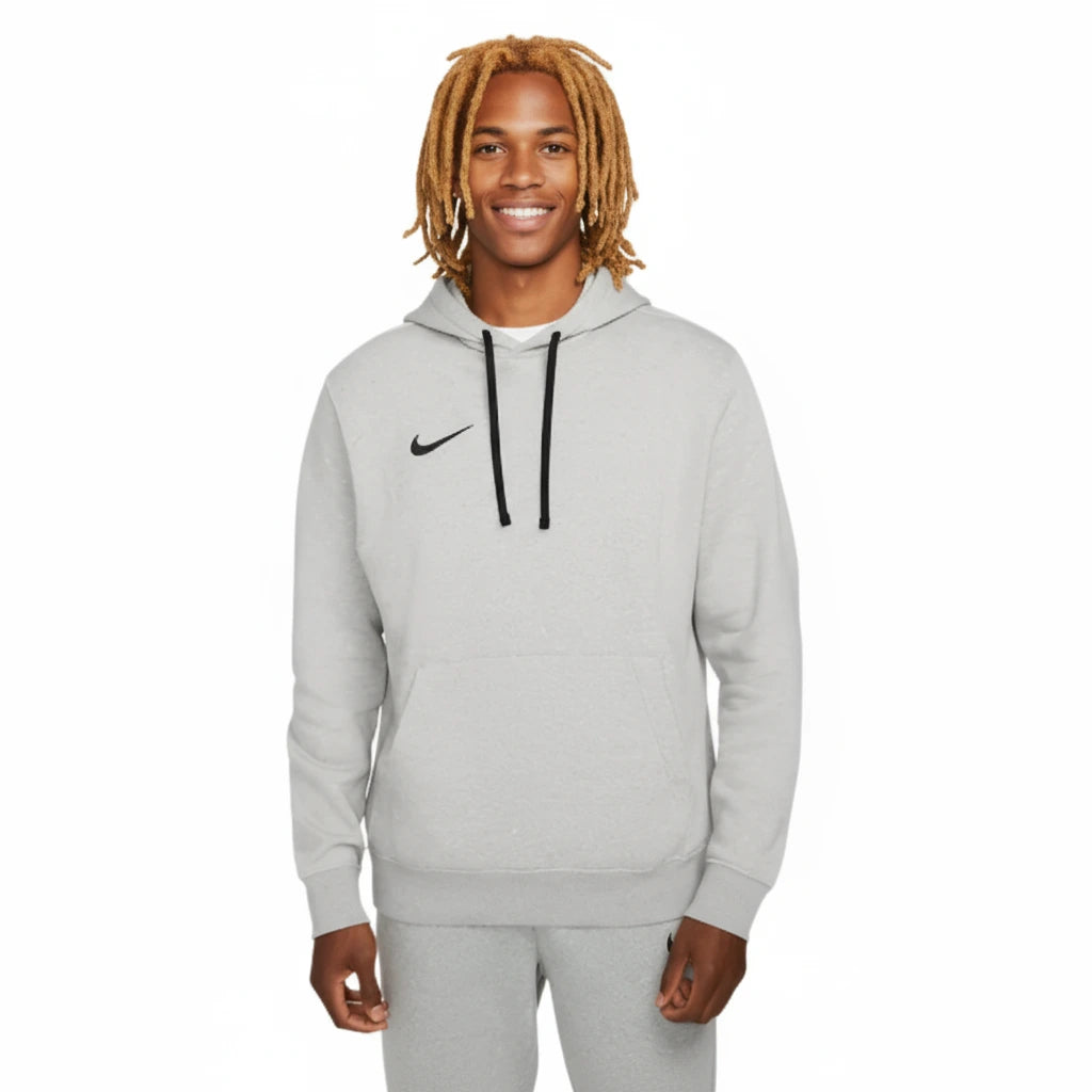 Person wearing a gray Nike hoodie on a white background