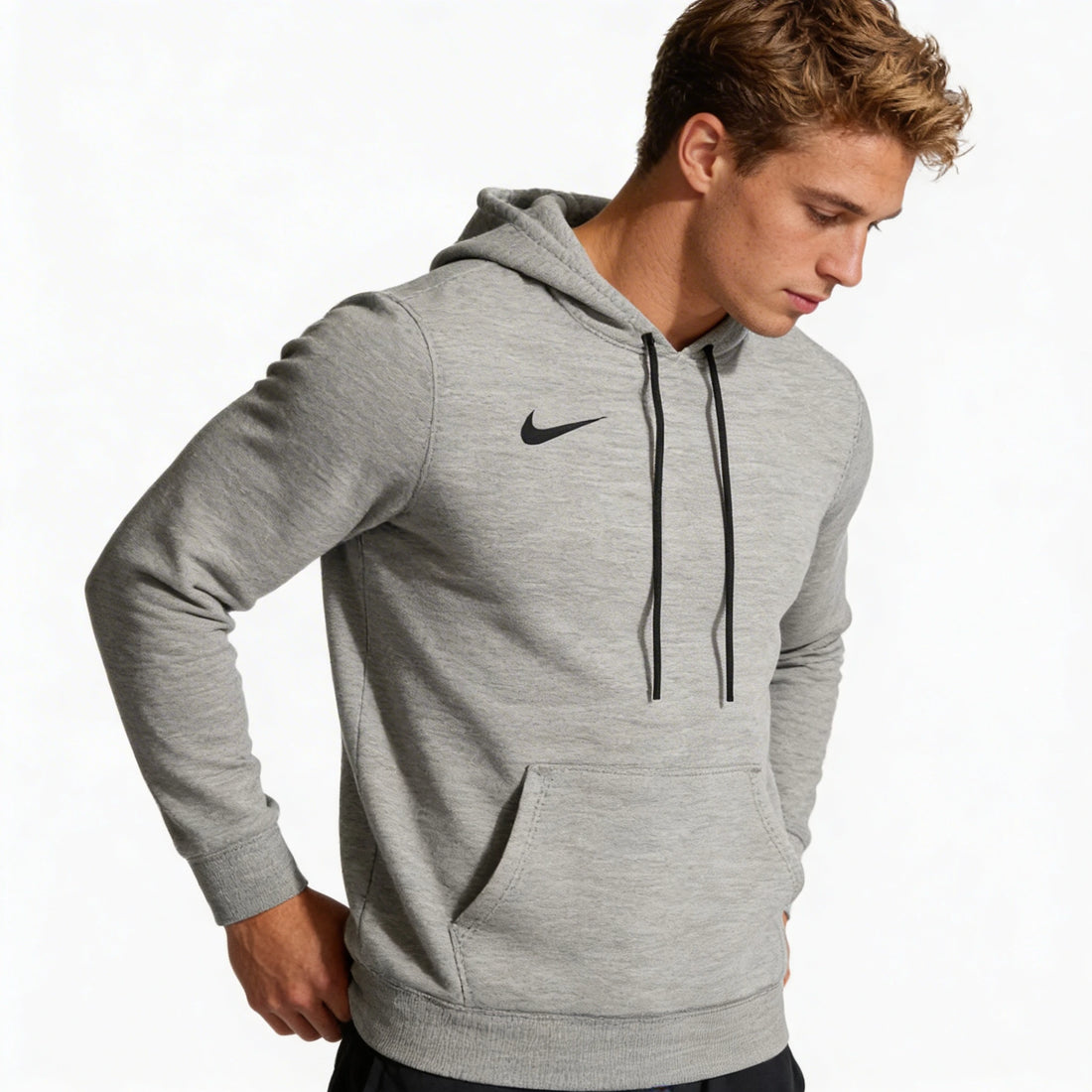 Man wearing a gray Nike hoodie on a white background