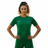 Woman wearing a green sports outfit with a Nike logo on a white background