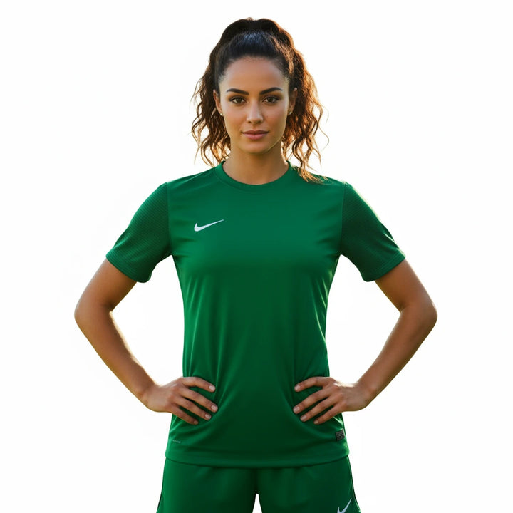 Woman wearing a green sports outfit with a Nike logo on a white background