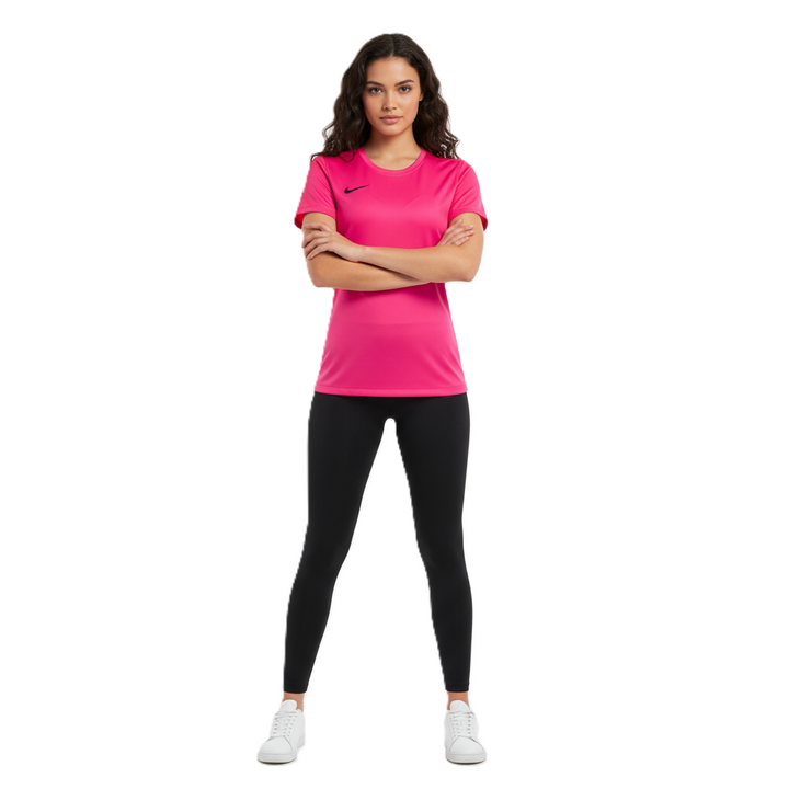 Woman wearing a pink Nike t-shirt and black leggings on a white background