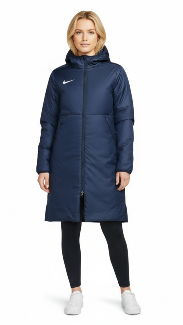 Woman wearing a blue Nike parka on a white background