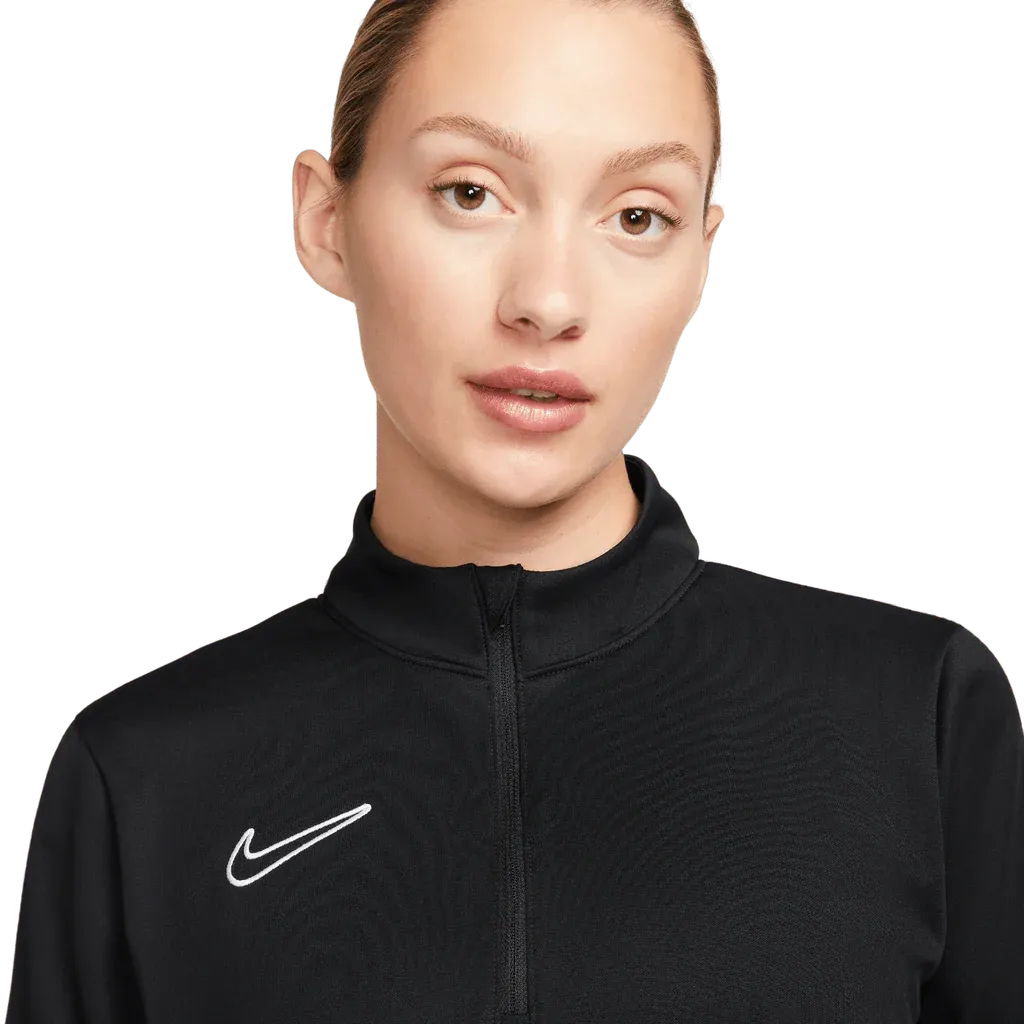 Close-up of woman wearing Nike Academy Pro Jacket in black with white Swoosh logo

