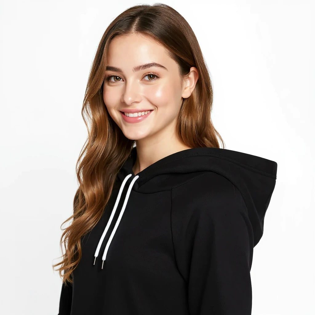 Woman wearing a black Nike Park 20 hoodie with white drawstrings on a white background