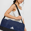 Angled side view of navy Adidas duffel bag worn over shoulder