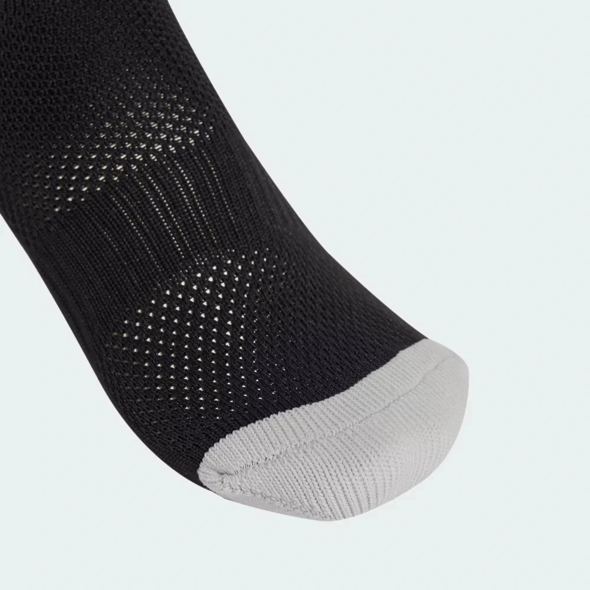 Close-up of grey toe area on Adidas Milano 23 black compression socks