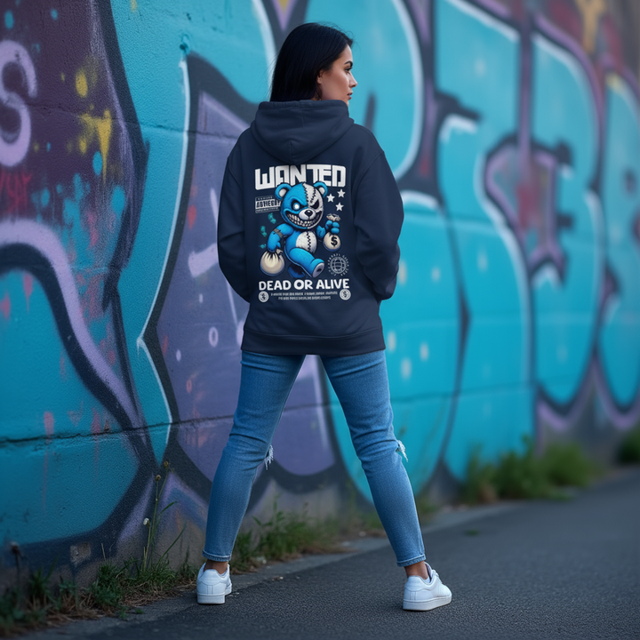 Person wearing an Empulse x Adidas hoodie with a graphic design in front of a graffiti-covered wall.