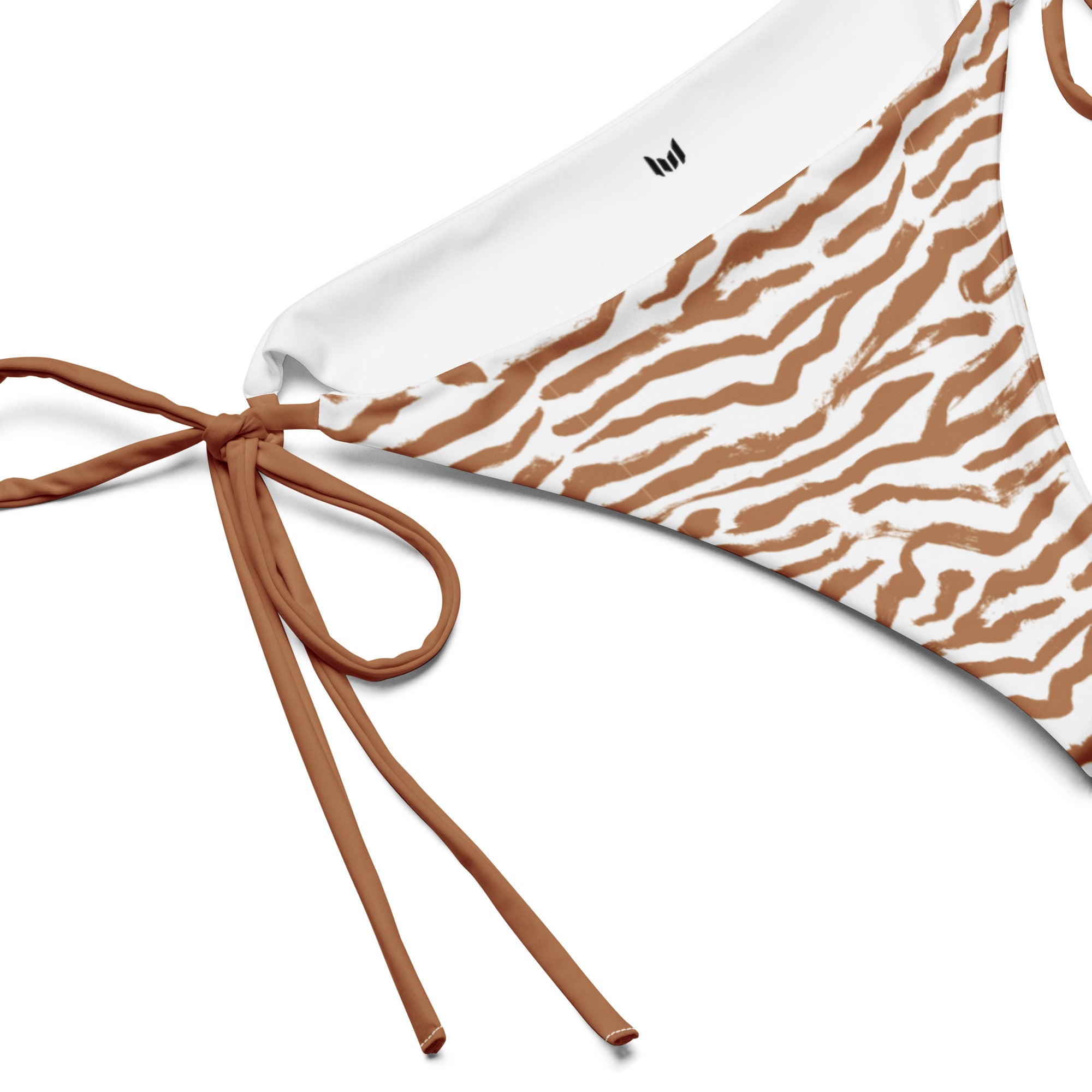Tie detail close-up of Empulse™ Zebra Khaki bikini bottom on white background