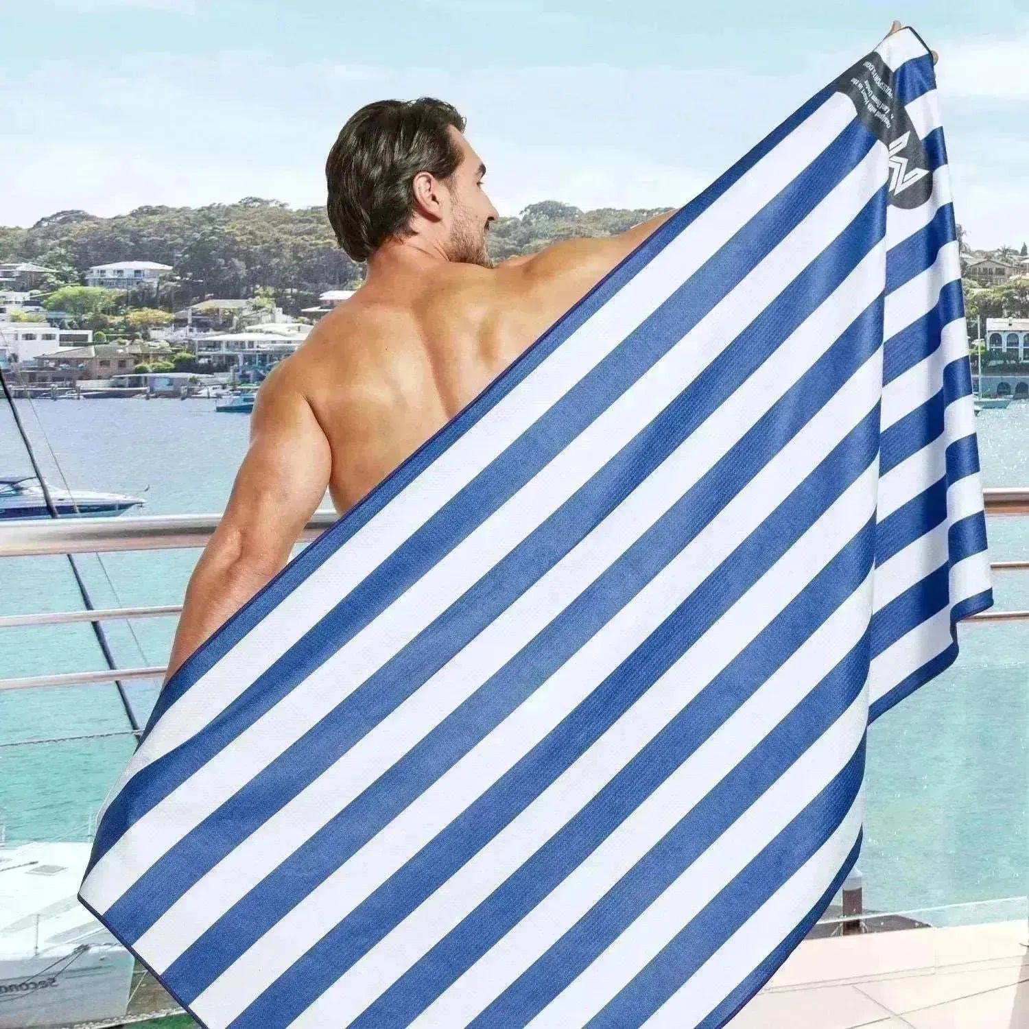 Man holding Cabana towel wide open showing full stripe