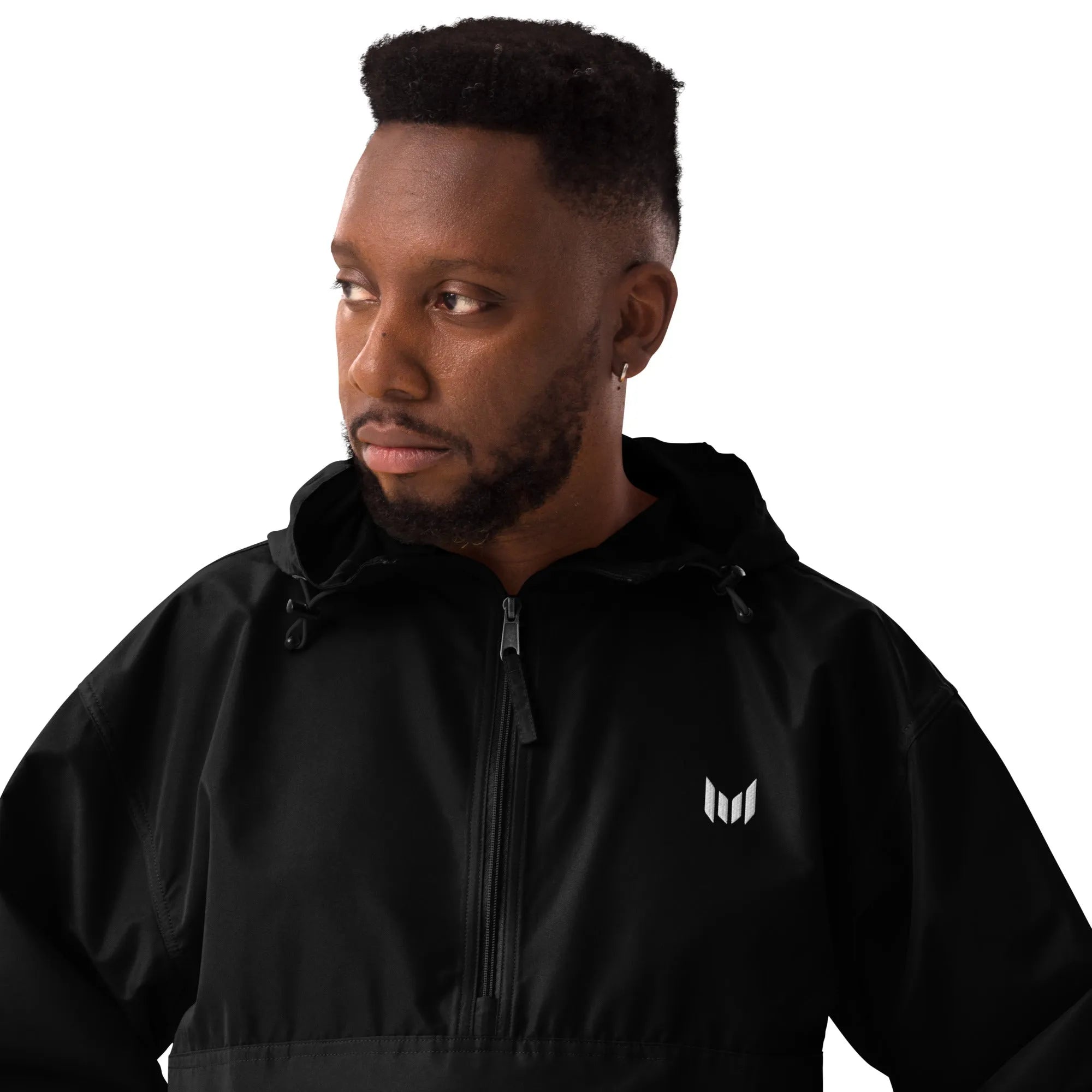 Man in black Empulse windbreaker, close-up of chest logo