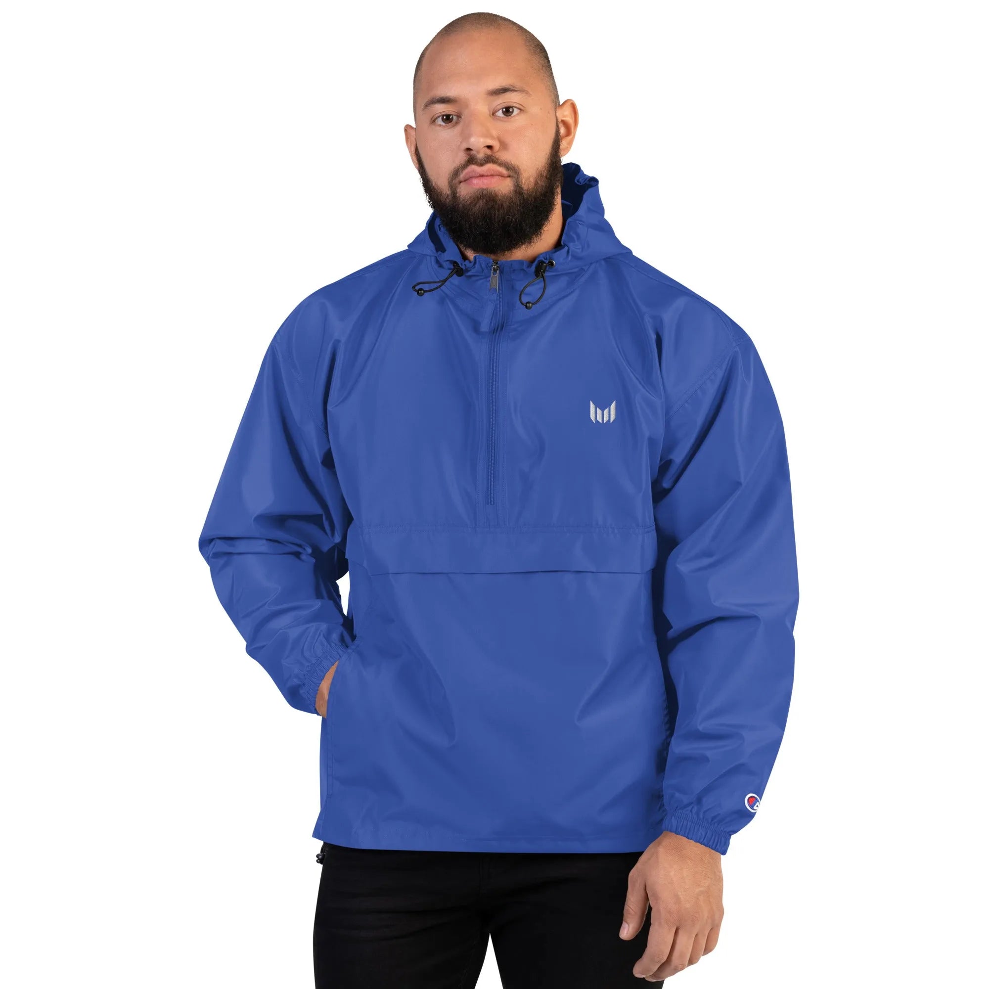 Man wearing blue Empulse windbreaker, hands in front pocket