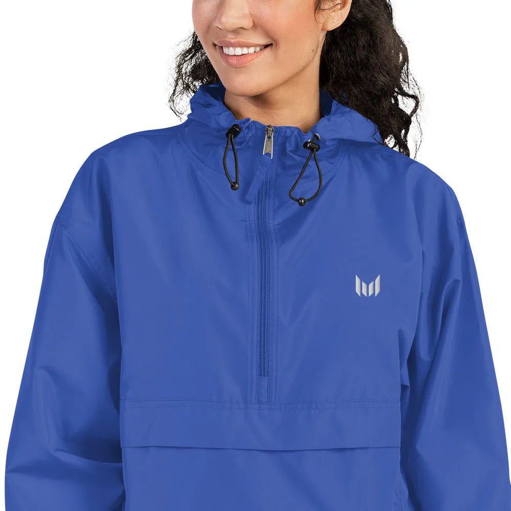 Woman in blue windbreaker, casual pose