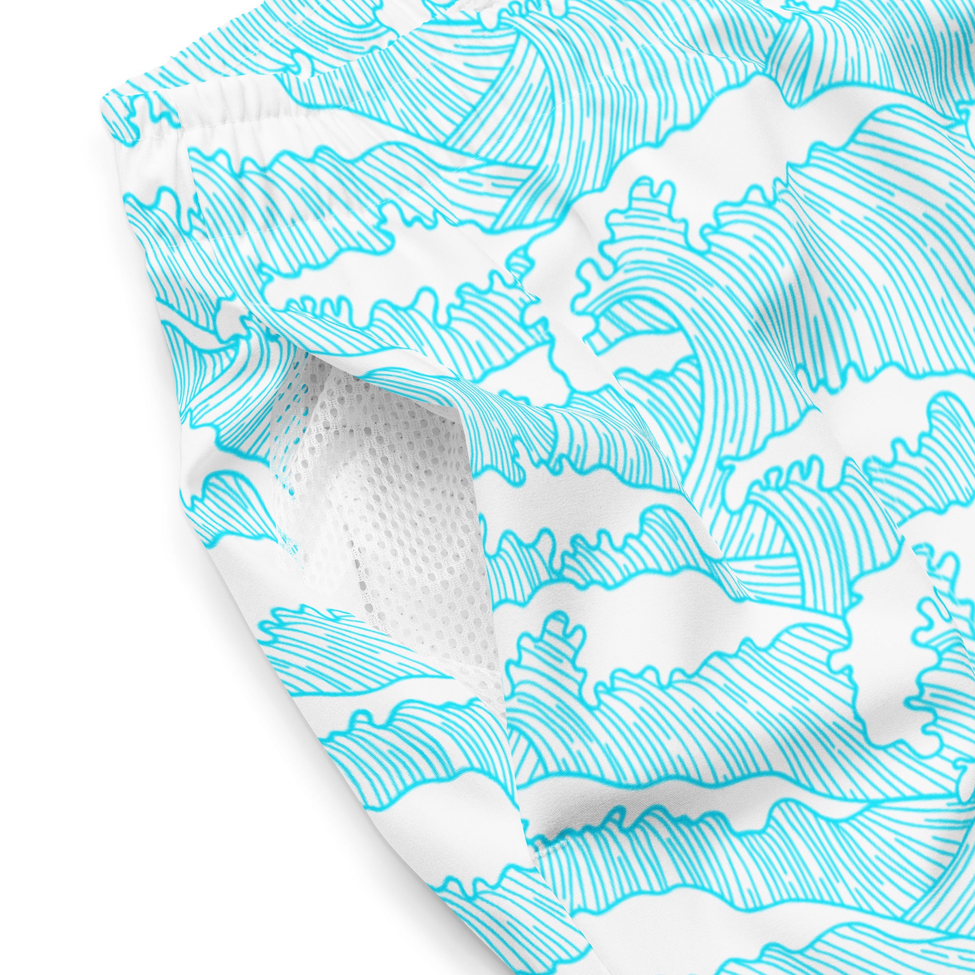 Close-up of Empulse™ Aqua Tides shorts fabric with detailed wave pattern and mesh pocket
