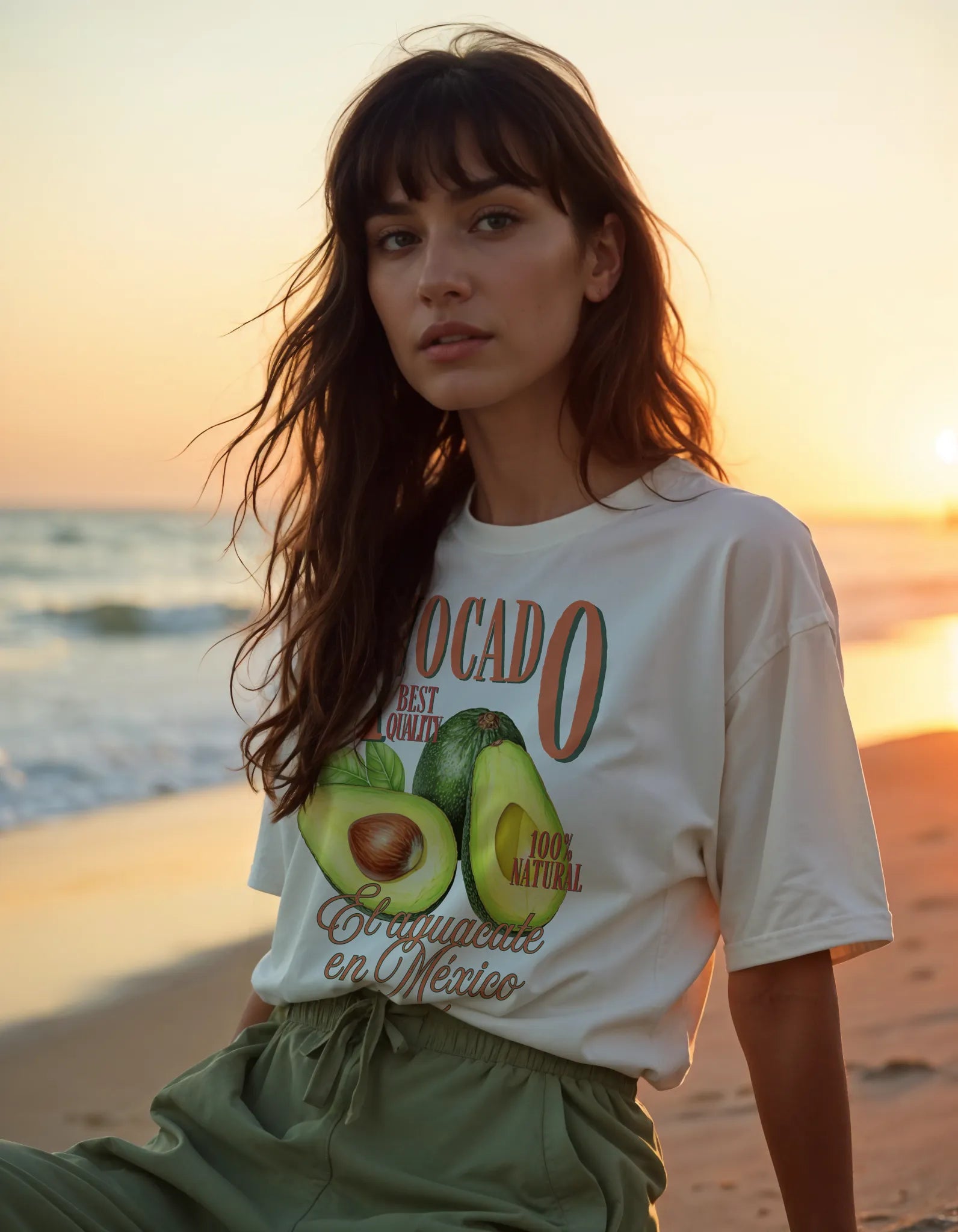 Empulse™ Avocado Sorona t-shirt worn during sunset at the beach, styled with laid-back energy