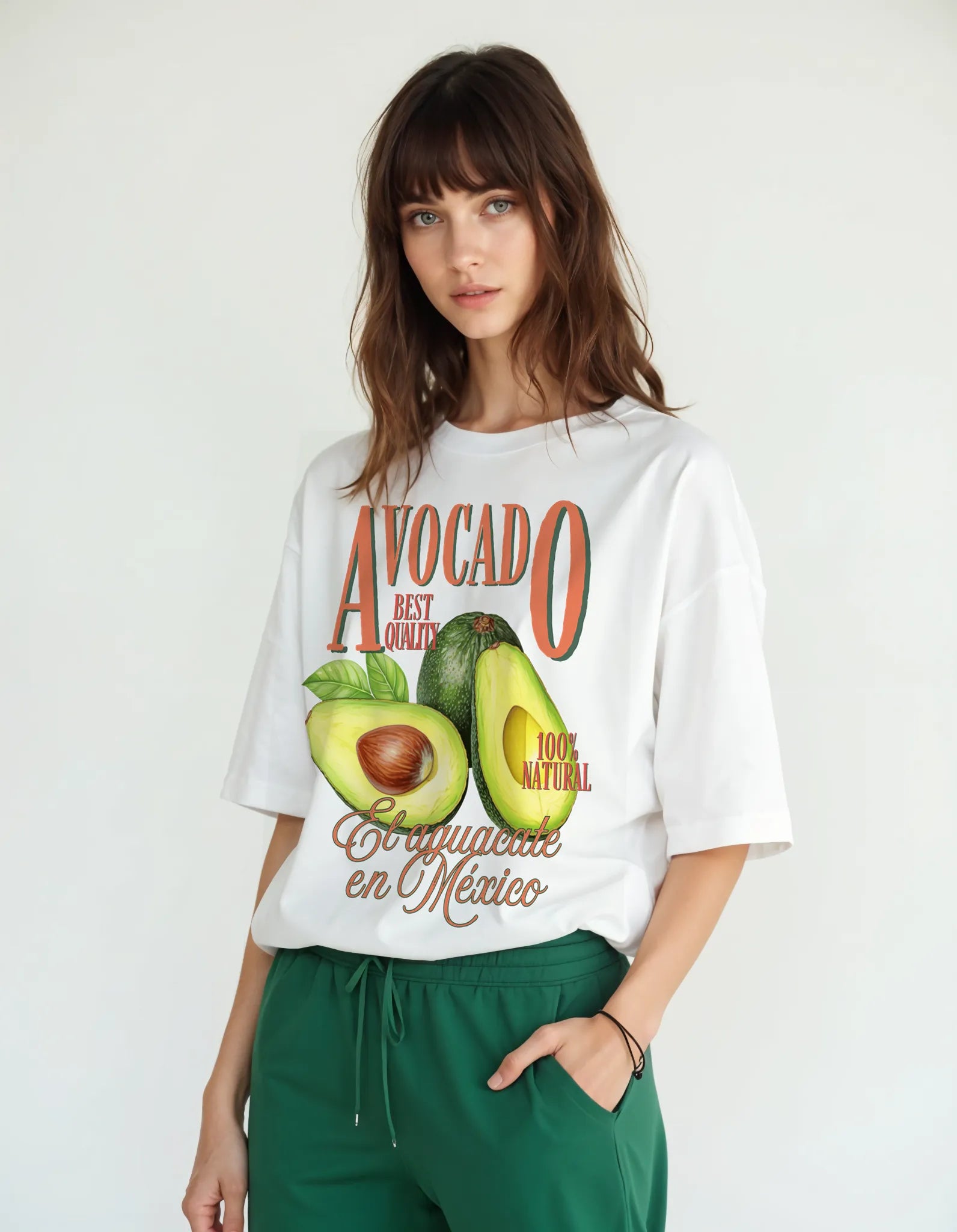 Empulse™ Avocado Sorona t-shirt in white featuring large avocado fruit graphic, worn by female model